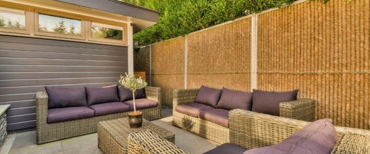 A picture of rattan sofas on a patio: outdoor commercial furniture