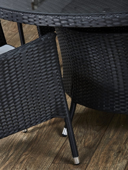 Black rattan table and chair. Rattan garden furniture. Small business