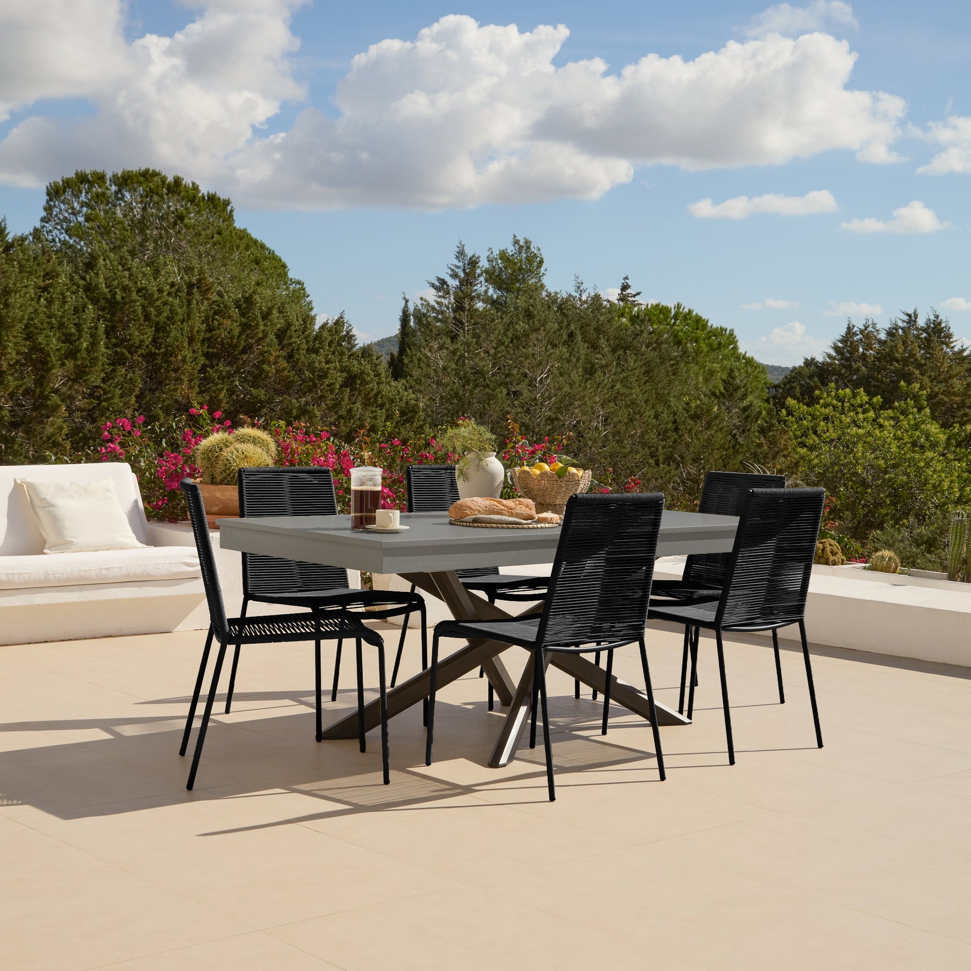 Amelia 6 Seater Dove Grey Concrete Garden Dining Set with Ryder Black Chairs - Laura James