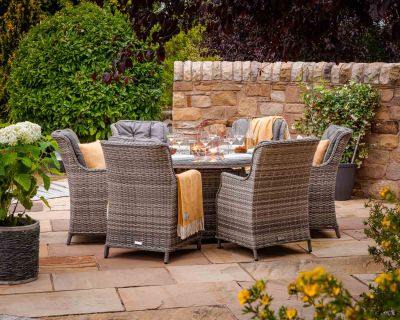 Riviera 6 Rattan Garden Chairs and Round Fire Pit Dining Table in Grey