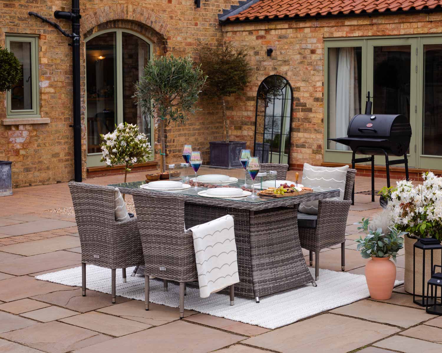 Product photograph of 4 Seat Rattan Garden Dining Set With Rectangular Table In Grey With Fire Pit - Cambridge - Rattan Direct from Rattan Direct