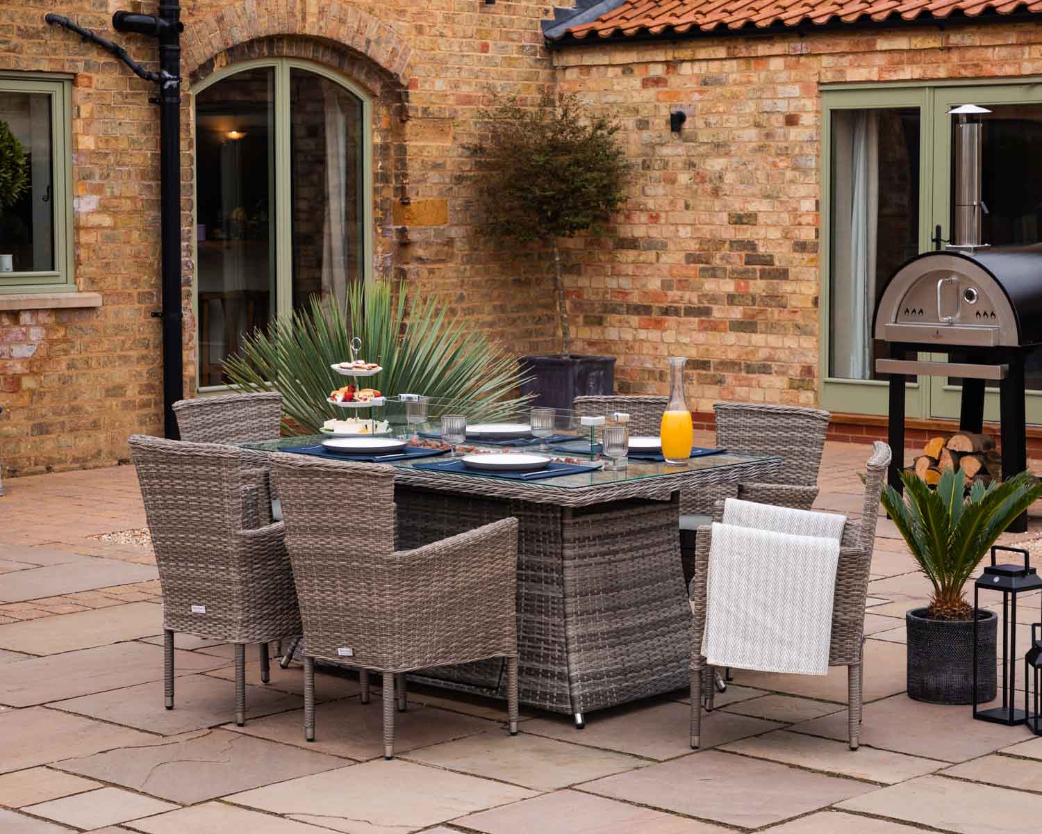 Product photograph of 6 Seat Rattan Garden Dining Set With Rectangular Table In Grey With Fire Pit - Cambridge - Rattan Direct from Rattan Direct