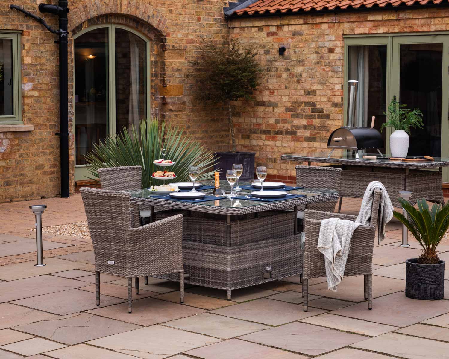 Product photograph of 4 Seat Rattan Garden Dining Set With Square Table In Grey With Ice Bucket - Cambridge - Rattan Direct from Rattan Direct