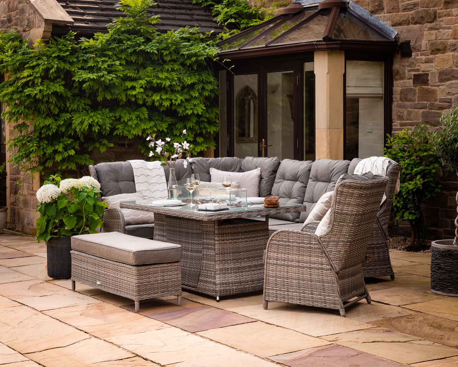 Product photograph of Reclining Rattan Corner Sofa Set With Rectangular Fire Pit Dining Table In Grey - Fiji - Rattan Direct from Rattan Direct