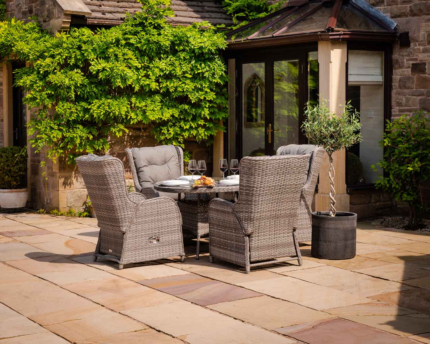 Product photograph of Reclining Rattan Garden Dining Set With 4 Chairs Round Table In Grey - Fiji - Rattan Direct from Rattan Direct