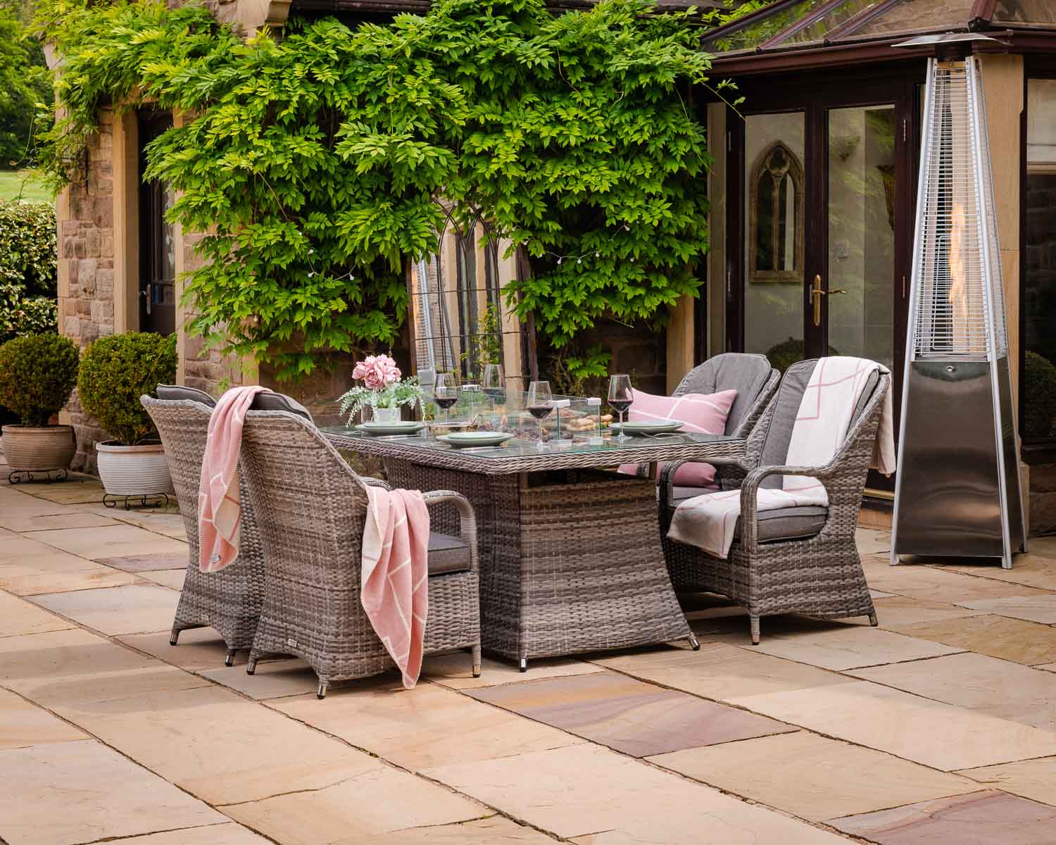 Product photograph of 4 Seat Rattan Garden Dining Set With Rectangular Table In Grey With Fire Pit - Marseille - Rattan Direct from Rattan Direct