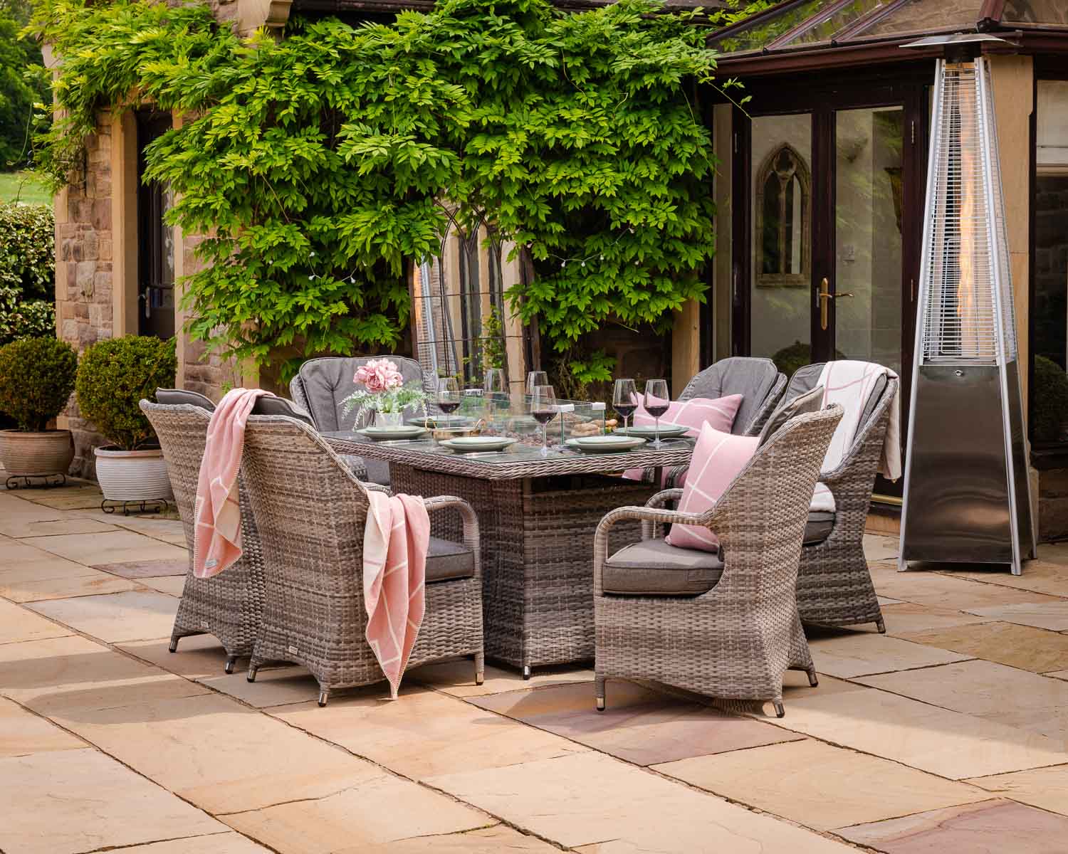 Product photograph of 6 Seat Rattan Garden Dining Set With Rectangular Table In Grey With Fire Pit - Marseille - Rattan Direct from Rattan Direct