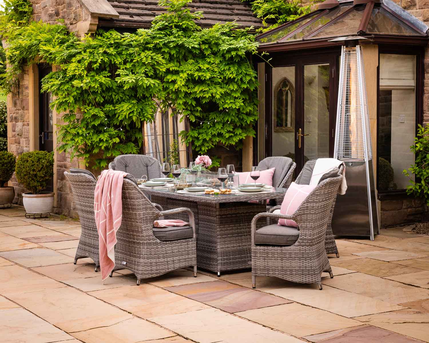 Product photograph of 6 Seater Rattan Garden Dining Set With Rectangular Table In Grey With Fire Pit - Marseille - Rattan Direct from Rattan Direct
