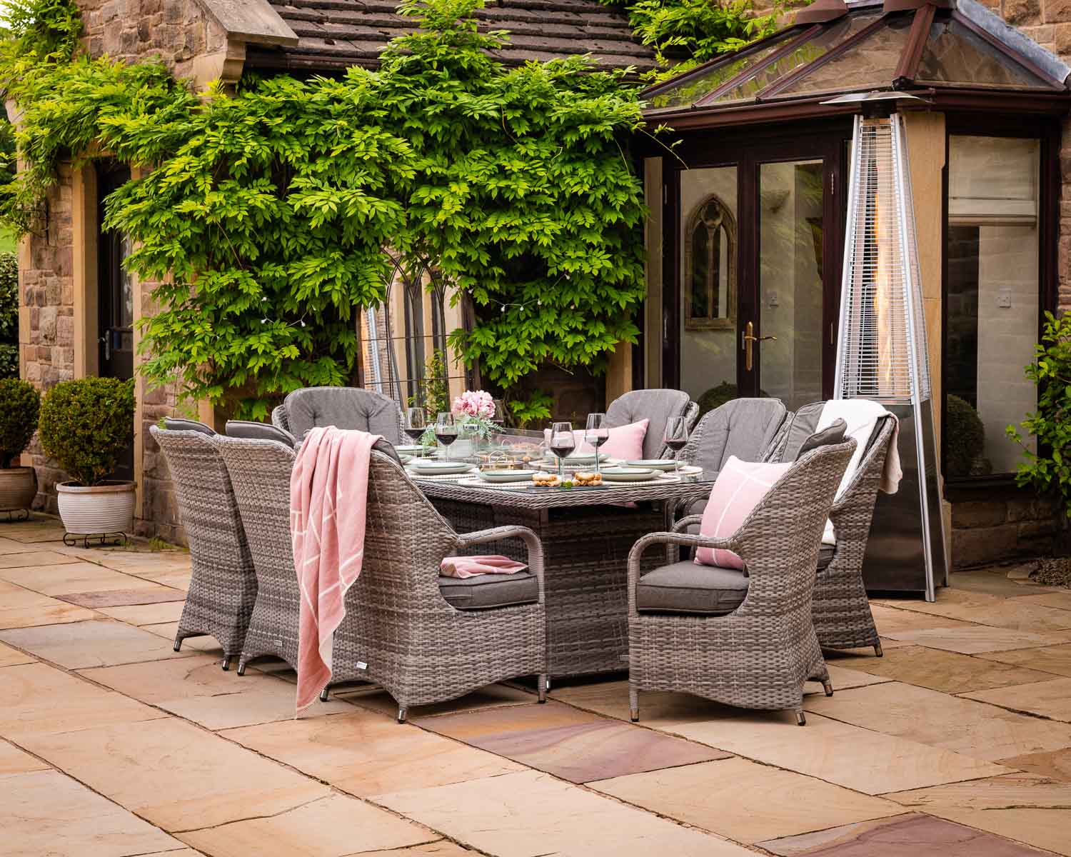 Product photograph of 8 Seat Rattan Garden Dining Set With Rectangular Table In Grey With Fire Pit - Marseille - Rattan Direct from Rattan Direct