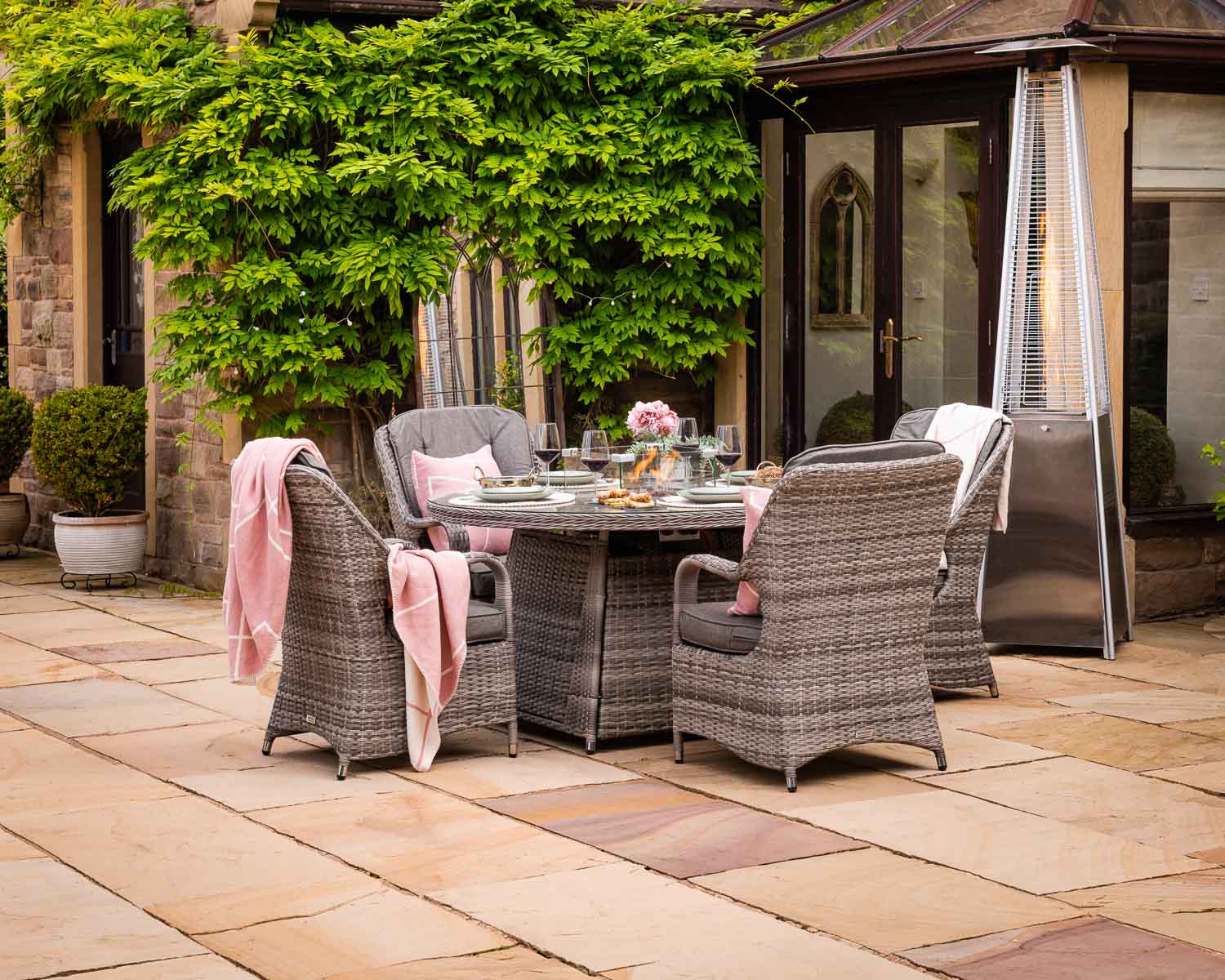 Product photograph of 4 Seat Rattan Garden Dining Set With Round Table In Grey With Fire Pit - Marseille - Rattan Direct from Rattan Direct