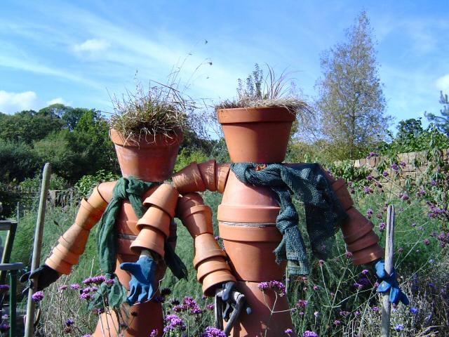 Two flower pot men, RHS Garden Rosemoor, Great Torrington, Devon. Autumn cleaning