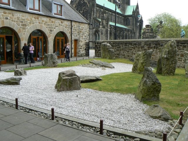The first permanent zen garden in the UK is at the St Mungo Museum of Religious Life and Art. Glasgow Cathedral is visible in the background.