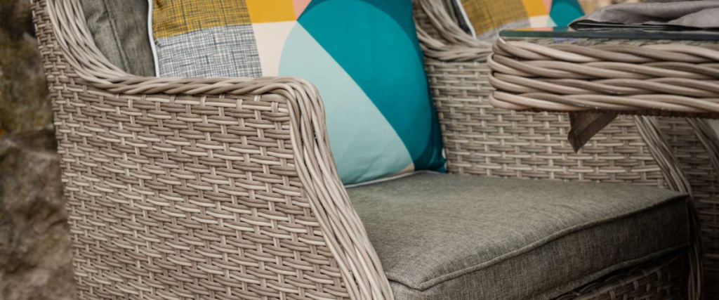 A picture of a rattan seat's armrest: garden furniture trends 
