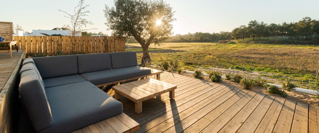 A picture of some outdoor furniture on a deck: how to prepare for spring 