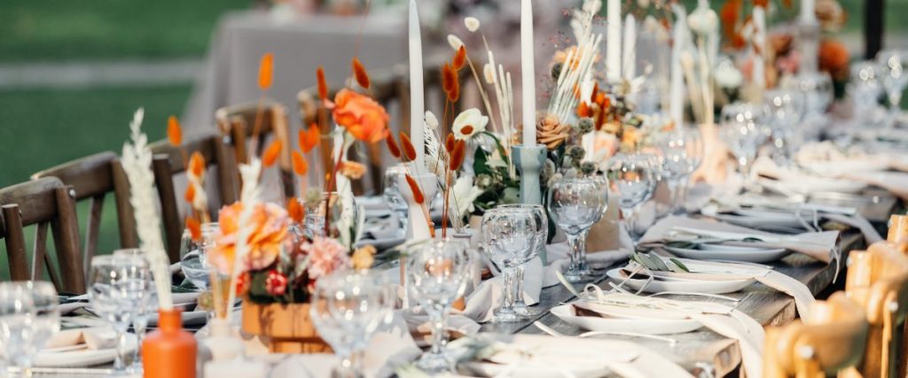A picture of a table setting with glassware, candles and flowers: alfresco entertaining 