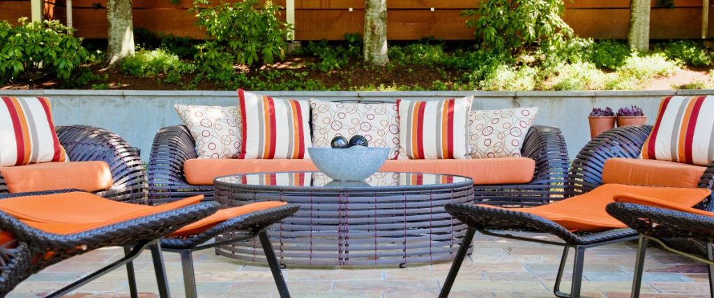 A picture of outdoor furniture with colourful cushions: outdoor commercial furniture