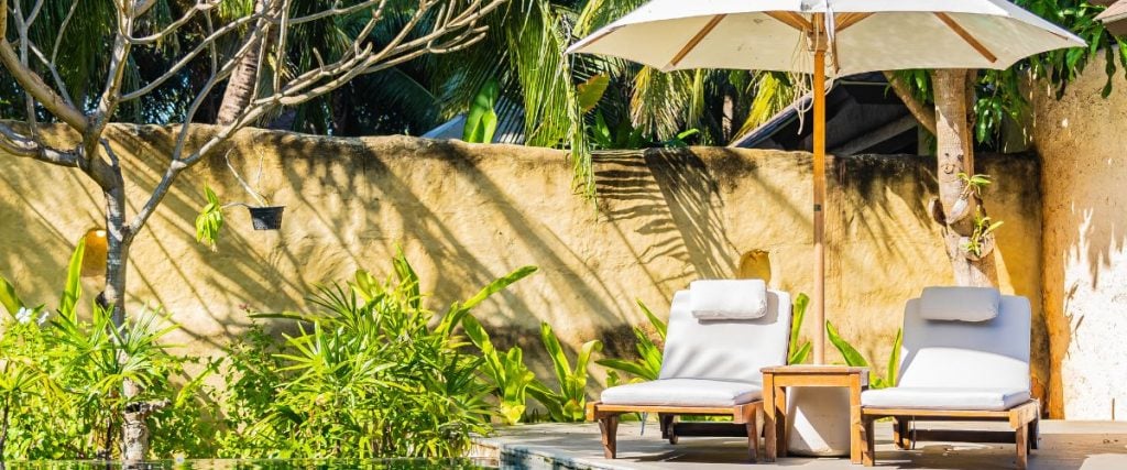 A picture of two sun loungers and a parasol: outdoor commercial furniture 