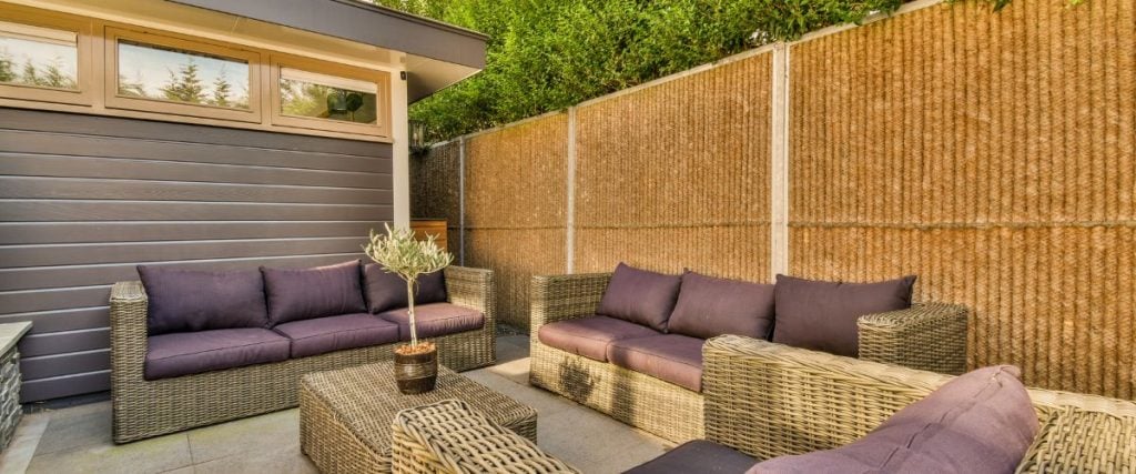 A picture of rattan sofas on a patio: outdoor commercial furniture 