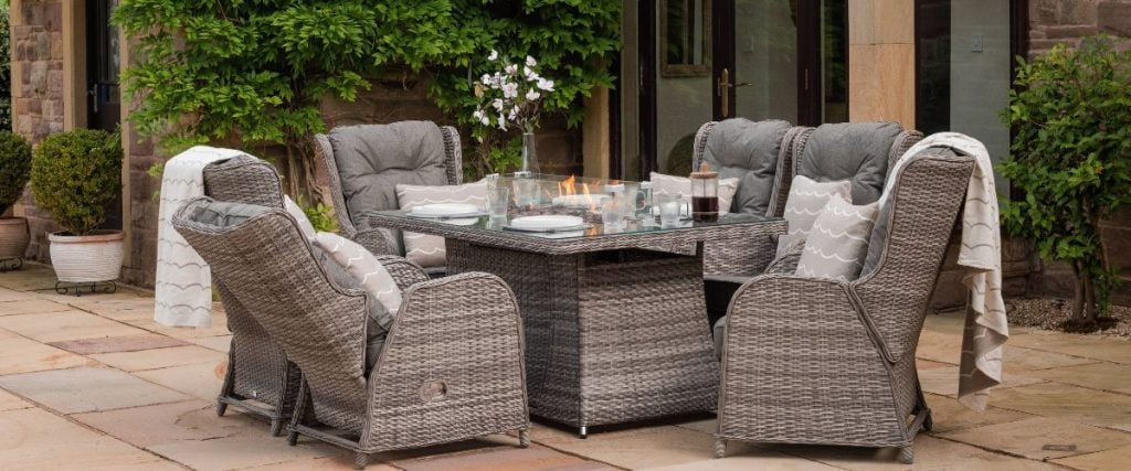 A picture of a rattan dining set with reclining chairs: garden makeover on a budget