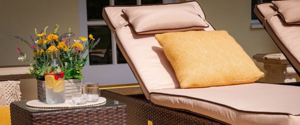 A picture of a rattan sun bed set: garden makeover on a budget 